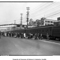 Bainbridge Island evacuees walking to train, March 30, 1942